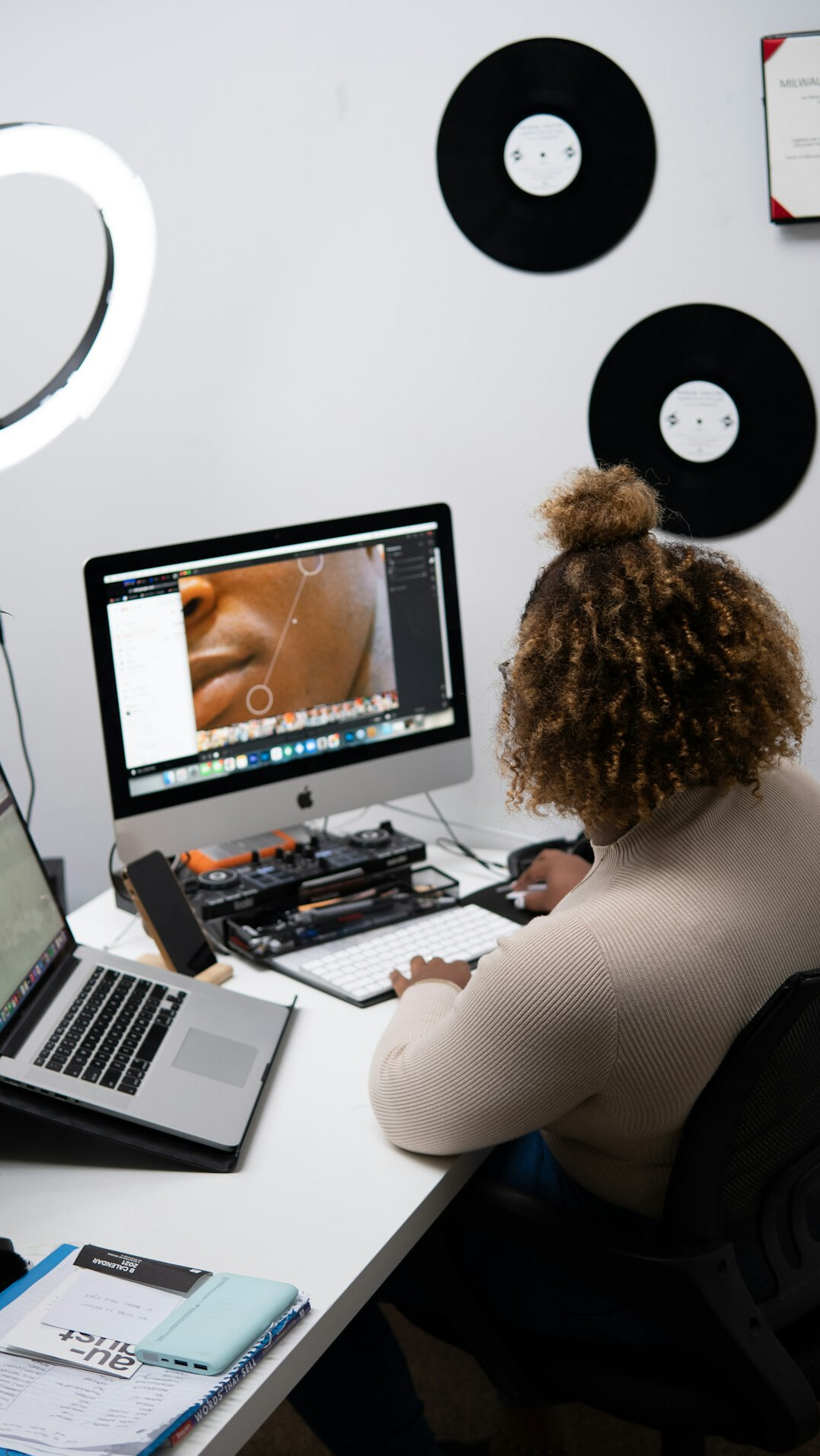 woman editing video on computer