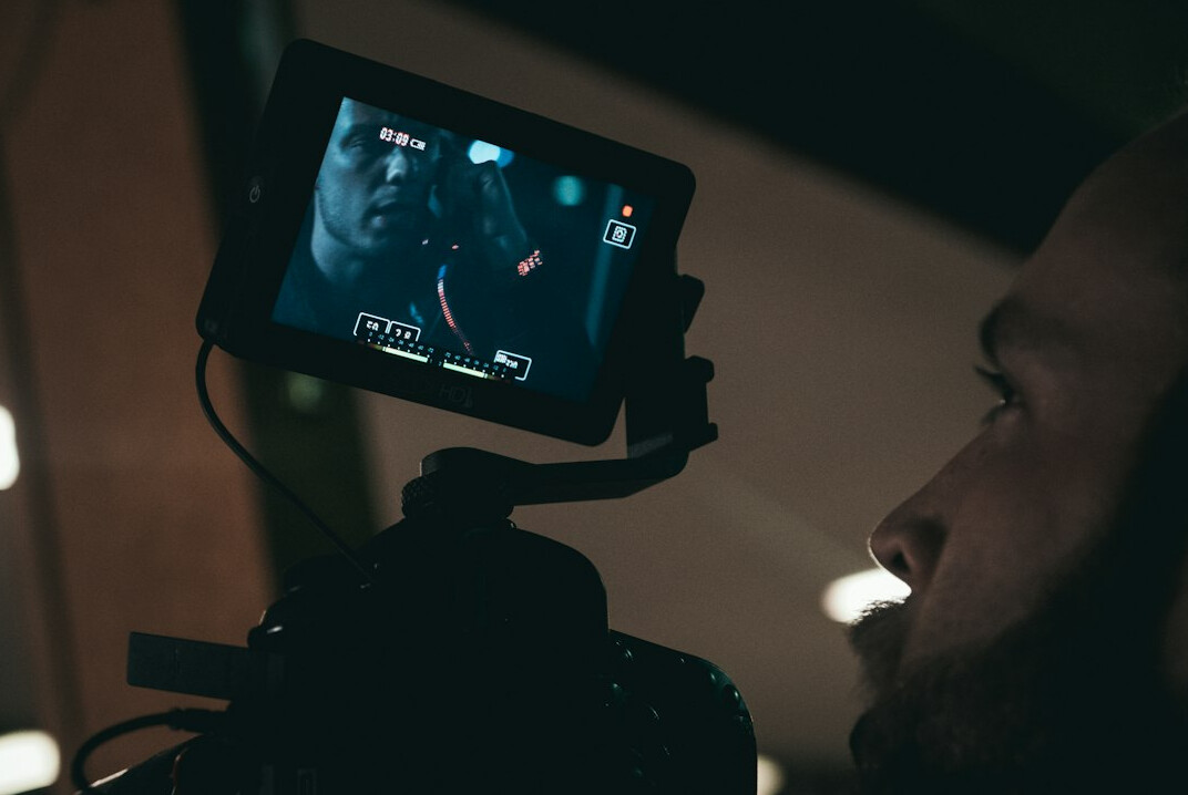 filmmaker reviewing cuts on monitor